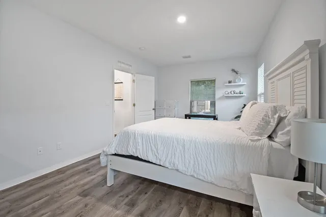 a bedroom with a bed and a couch