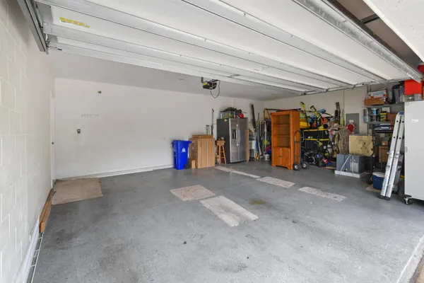 a view of a storage room with a fridge