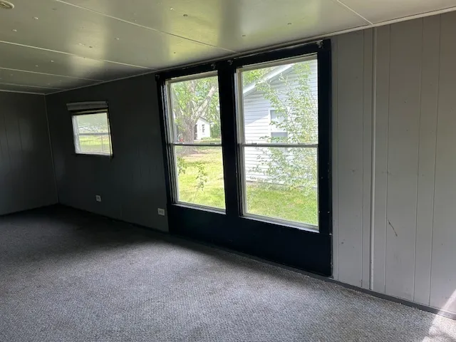 a view of an empty room with a window