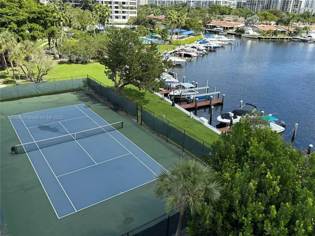 a view of a lake with a building and outdoor space