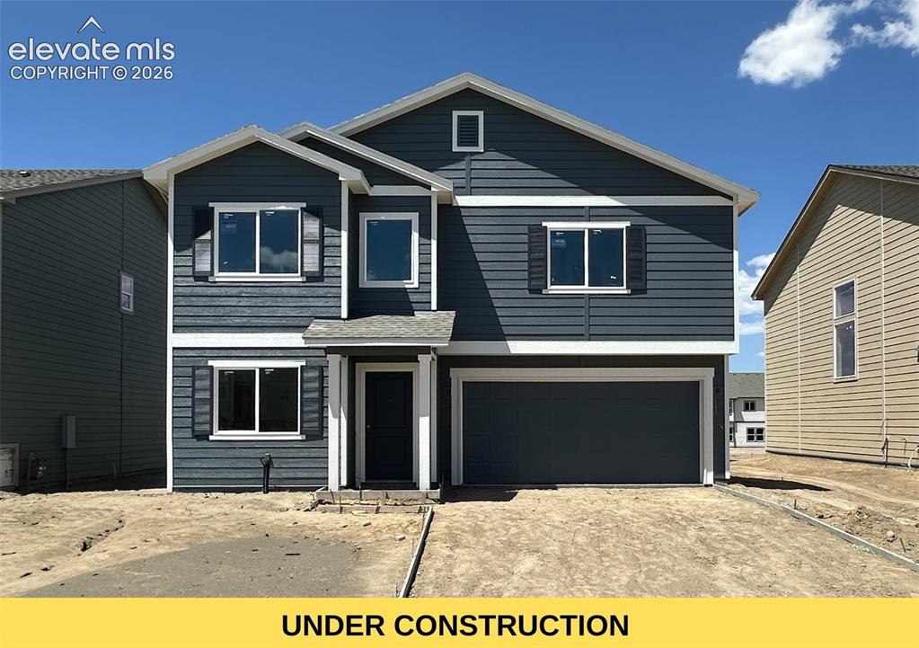 8230 Lemon Grass Road Falcon, CO 80831 - Photo 1 of 22 a front view of a house