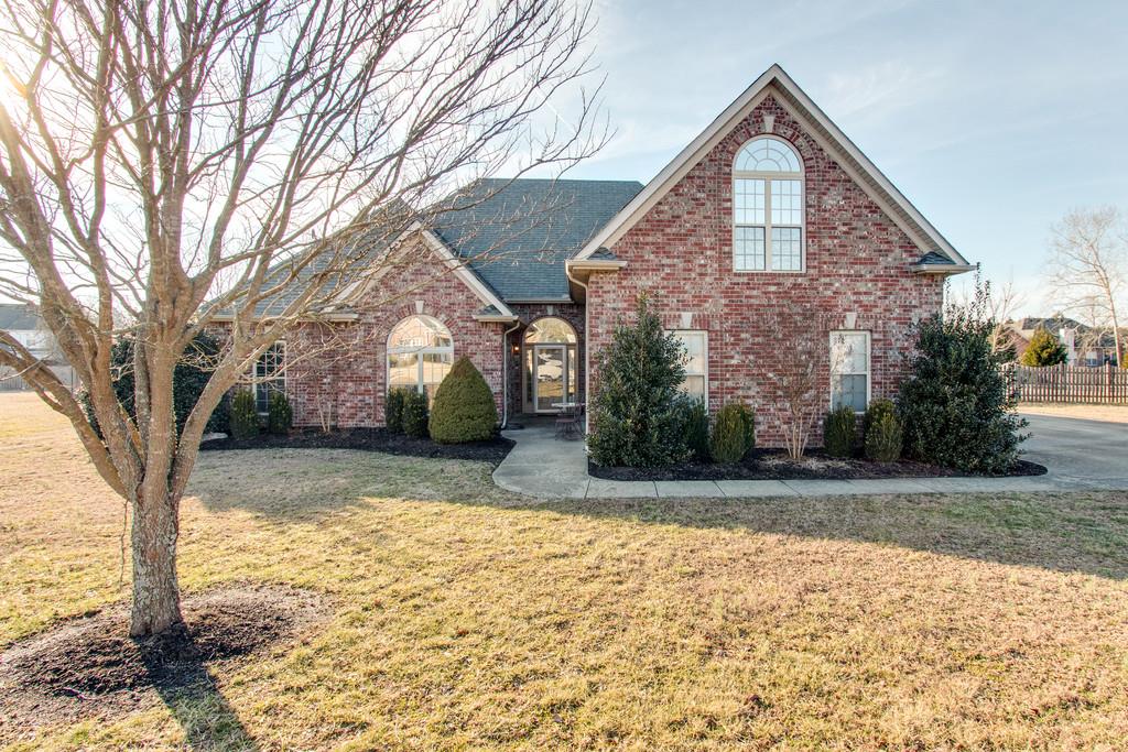 403 Reagan Road Mount Juliet, TN 37122 - Photo 1 of 30 a front view of a house with a yard and garage