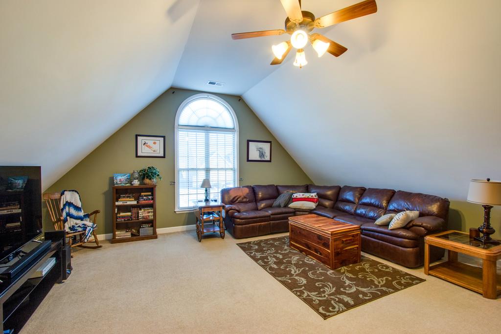403 Reagan Road Mount Juliet, TN 37122 - Photo 13 of 30 a living room with furniture a window and gym equipment
