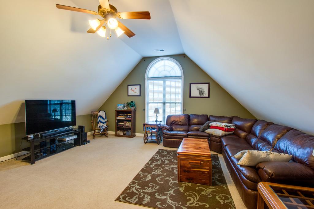 403 Reagan Road Mount Juliet, TN 37122 - Photo 14 of 30 a living room with furniture a flat screen tv and a large window