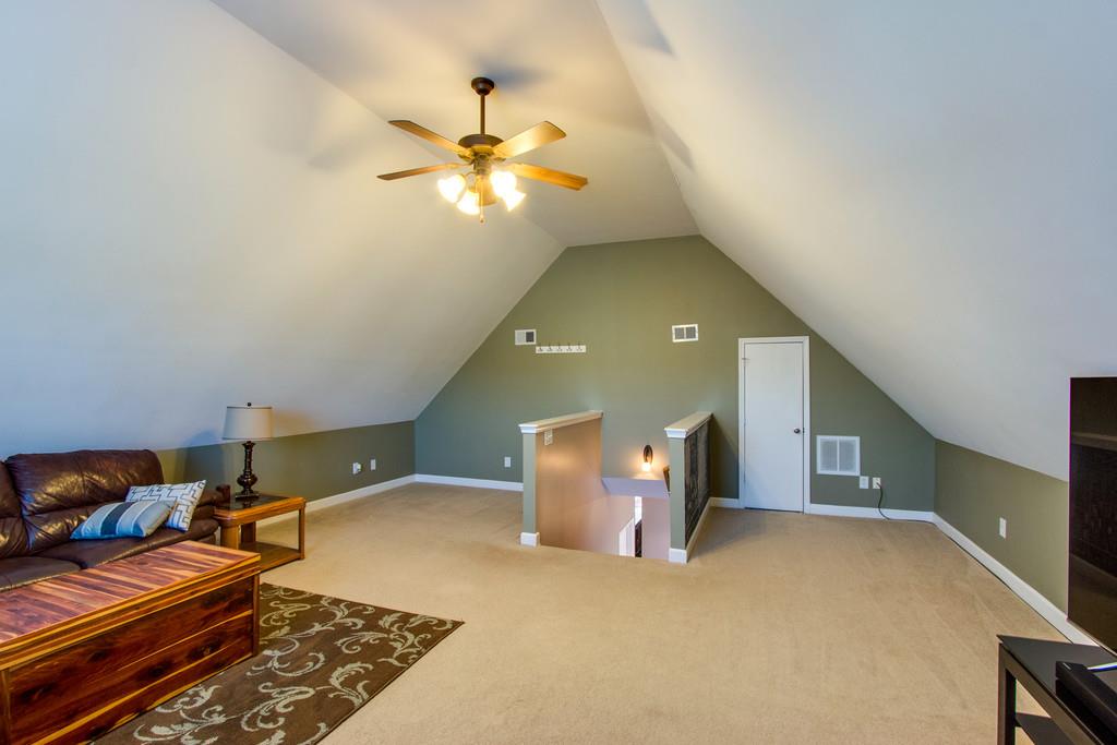 403 Reagan Road Mount Juliet, TN 37122 - Photo 15 of 30 a bedroom with a bed and a chandelier
