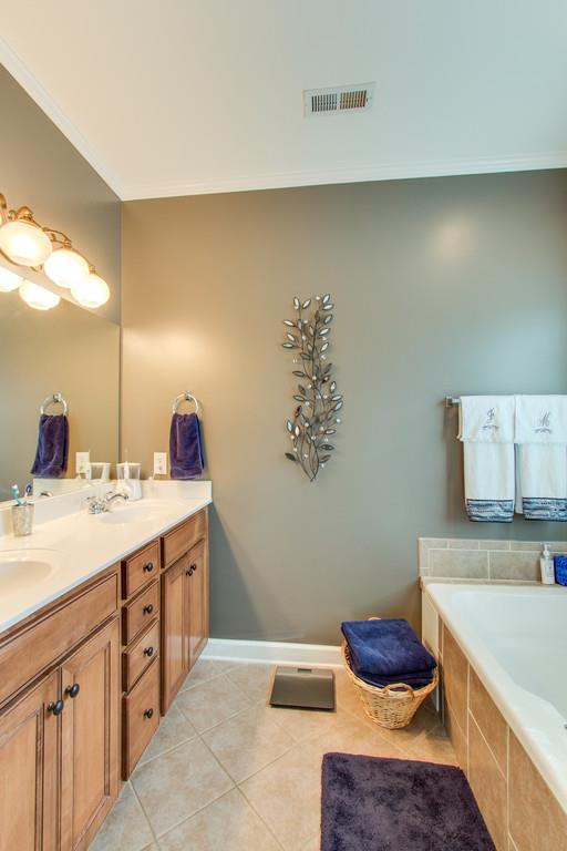403 Reagan Road Mount Juliet, TN 37122 - Photo 18 of 30 a spacious bathroom with a tub sink and mirror