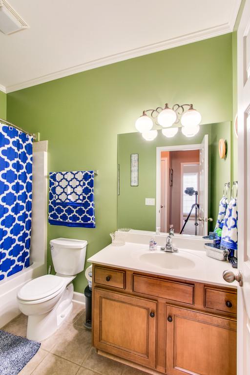 403 Reagan Road Mount Juliet, TN 37122 - Photo 23 of 30 a bathroom with a sink a toilet and mirror