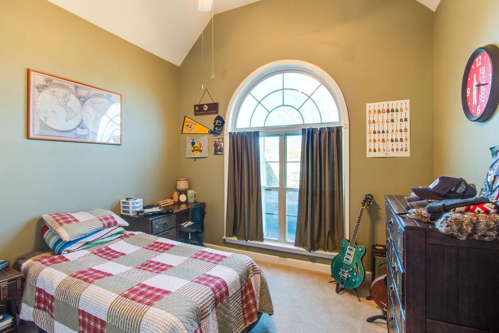 403 Reagan Road Mount Juliet, TN 37122 - Photo 24 of 30 a bedroom with a bed and a painting on the wall