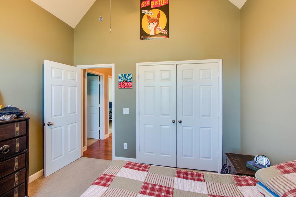 403 Reagan Road Mount Juliet, TN 37122 - Photo 25 of 30 a bedroom with a bed and a book shelf