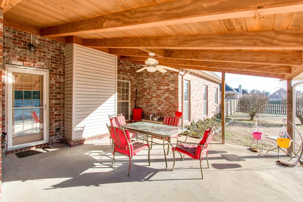 403 Reagan Road Mount Juliet, TN 37122 - Photo 27 of 30 a outdoor space with the couches and dining table with the potted plants