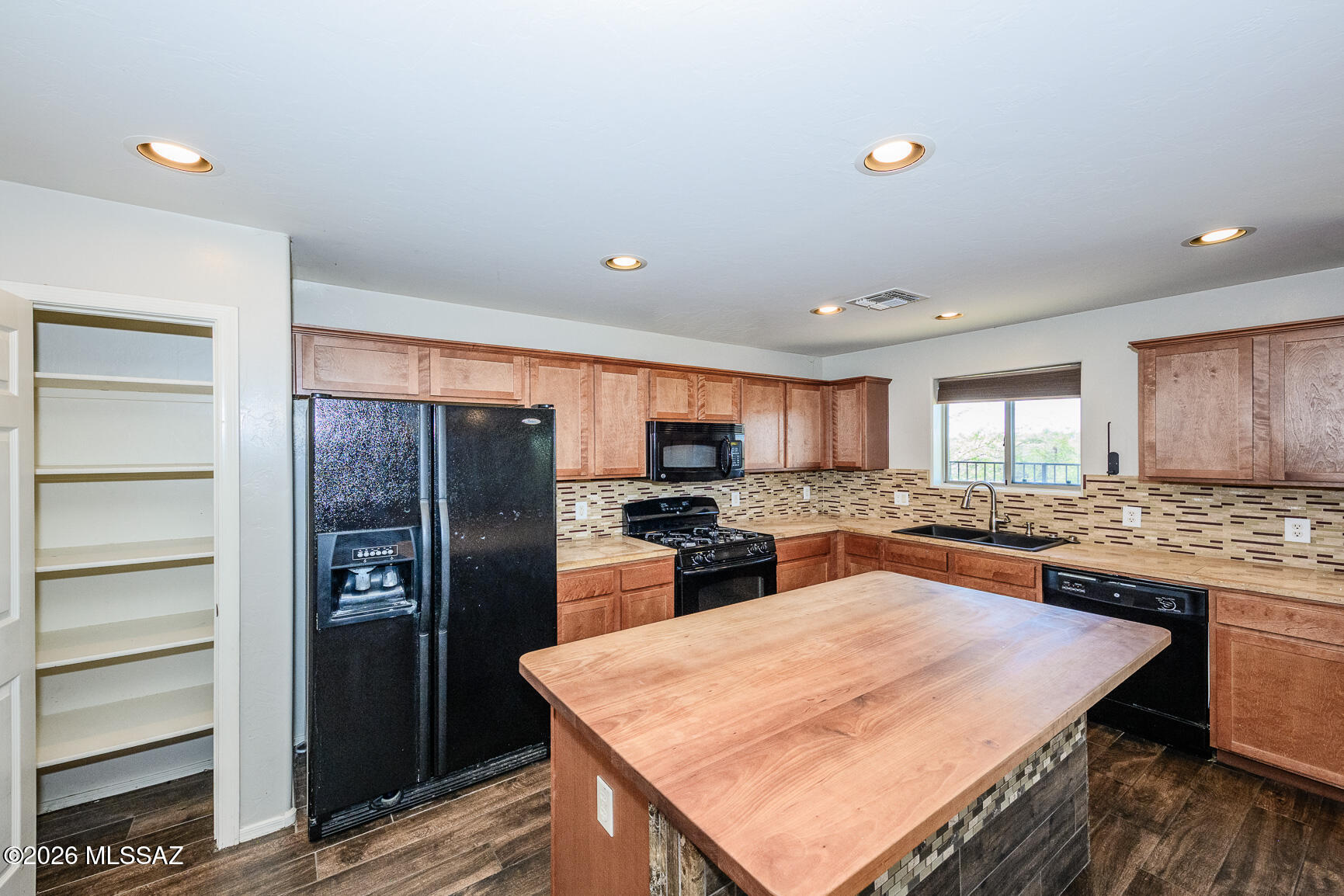 728 South Porter Routh Place Vail, AZ 85641 - Photo 8 of 36 a kitchen with stainless steel appliances granite countertop a refrigerator and a stove top oven