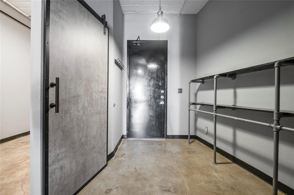 1122 Jackson Street, Unit 811 Dallas, TX 75202 - Photo 4 of 28 a view of a hallway