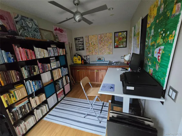 a bedroom with a bed window and dresser