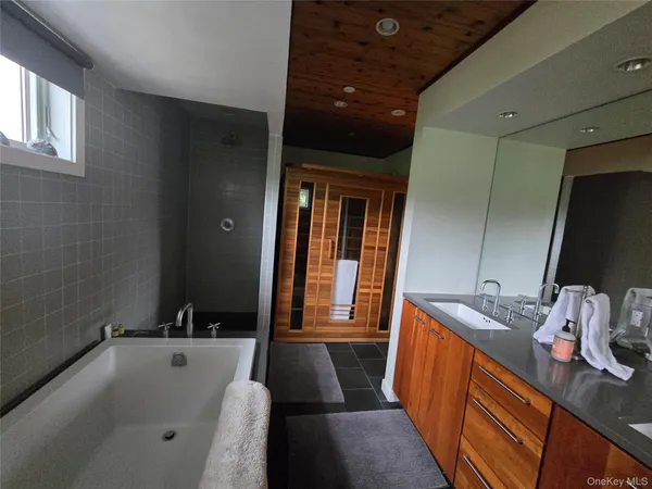 a bathroom with a sink a toilet and tub