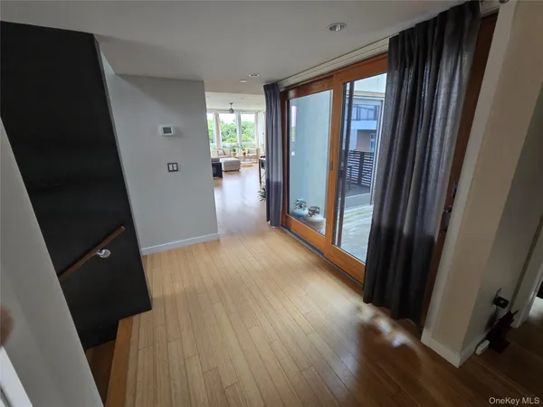 a view of entryway with wooden floor