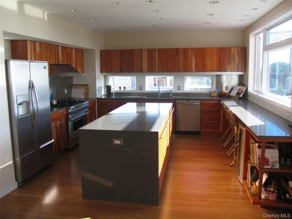 a kitchen with stainless steel appliances granite countertop a stove and a sink with granite countertops