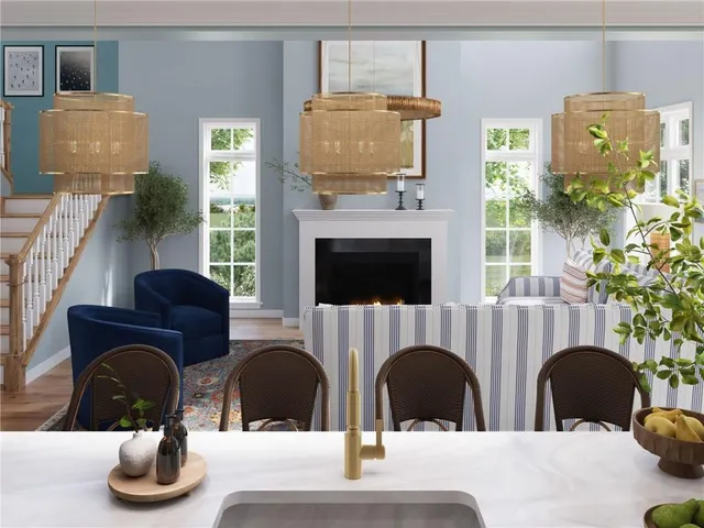 a dining room with furniture a chandelier and wooden floor