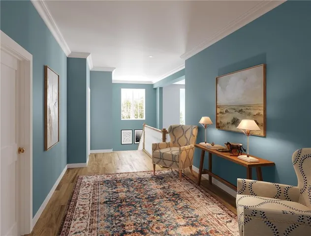 a living room with furniture rug and wooden floor