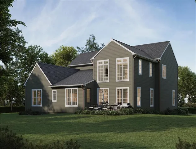 a view of a lake with a yard and a wooden floor