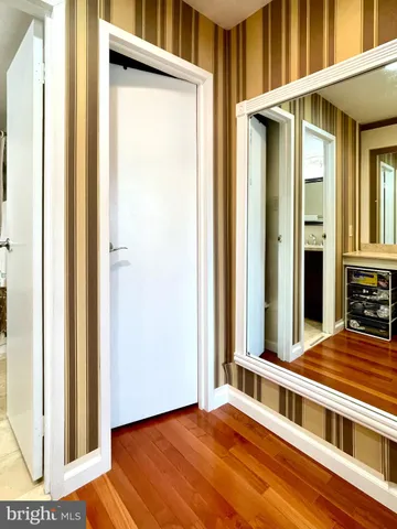 a view of a balcony with a door and wooden floor