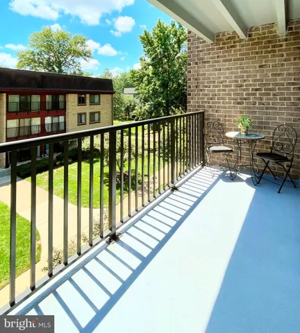 a view of balcony with furniture