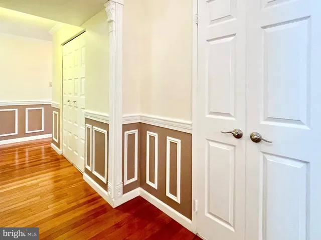 a view of a balcony with wooden floor and windows