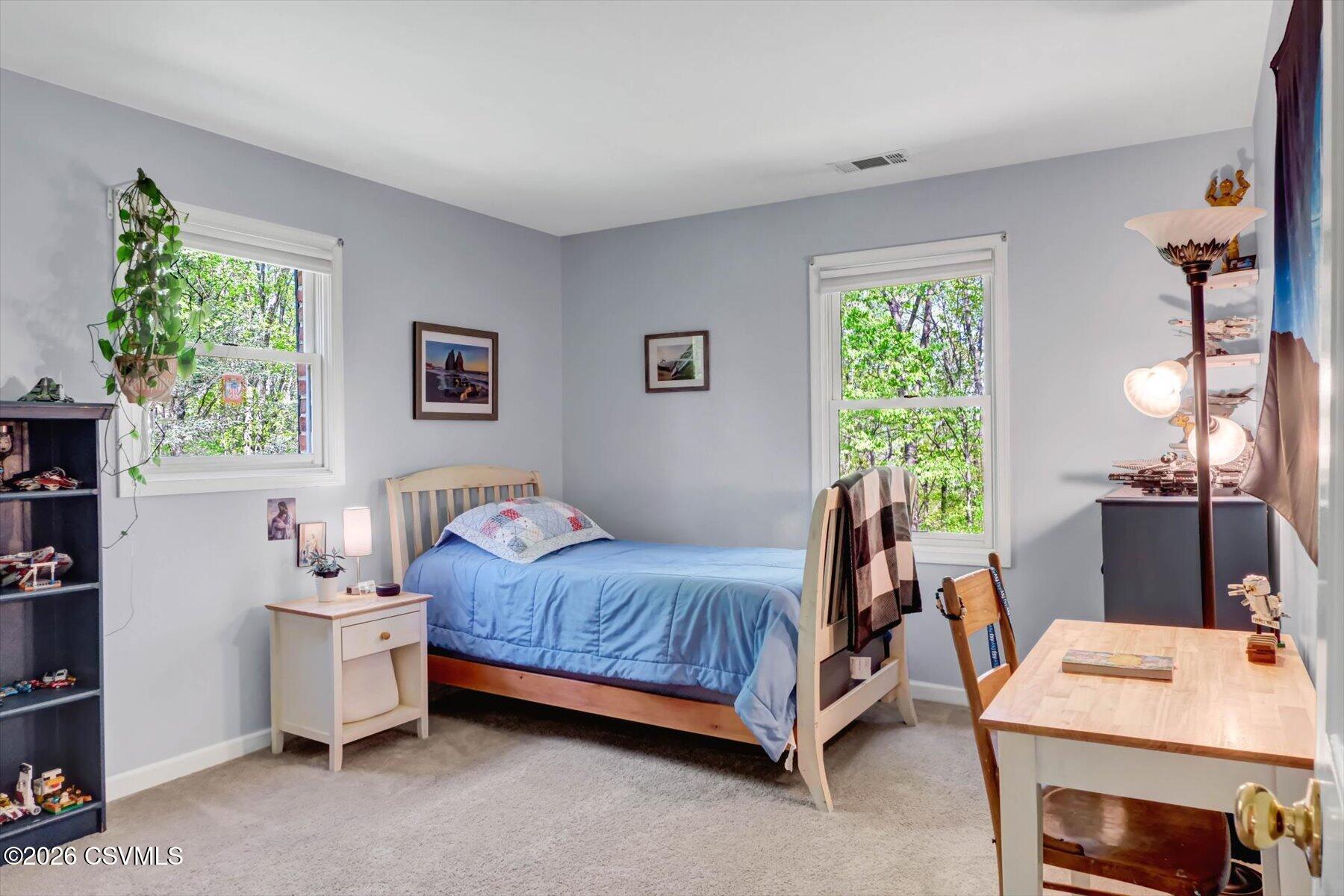65 Crestview Drive Winfield, PA 17889 - Photo 44 of 70 a bedroom with a bed and a table