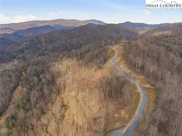 a view of a mountain in the distance in a field
