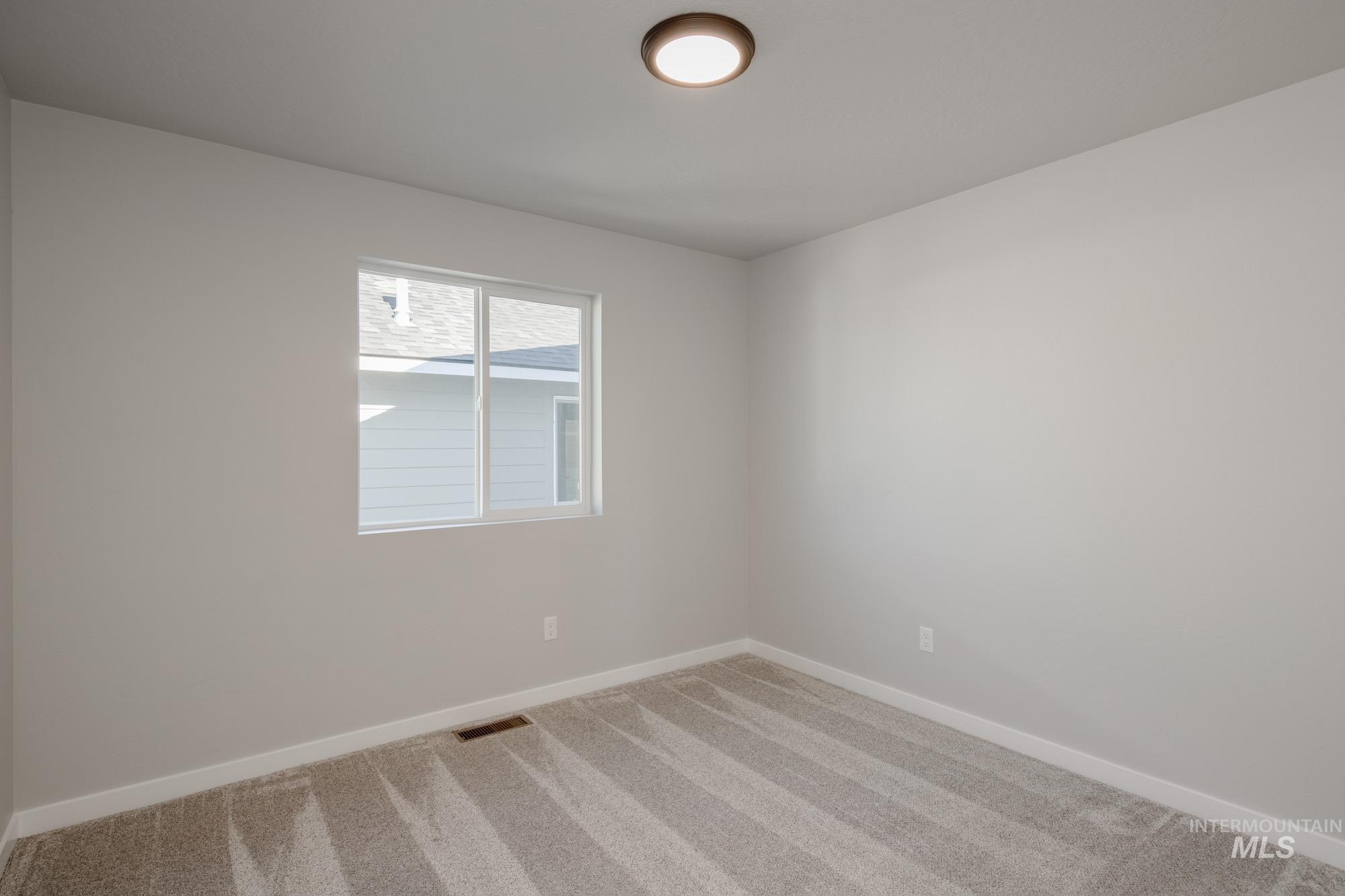 2168 South Border Way Meridian, ID 83642 - Photo 21 of 25 Carpeted empty room featuring baseboards