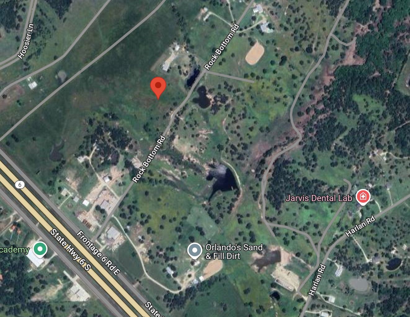 711 Rock Bottom Road Navasota, TX 77868 - Photo 2 of 6 an aerial view of multi story residential apartment building with green space