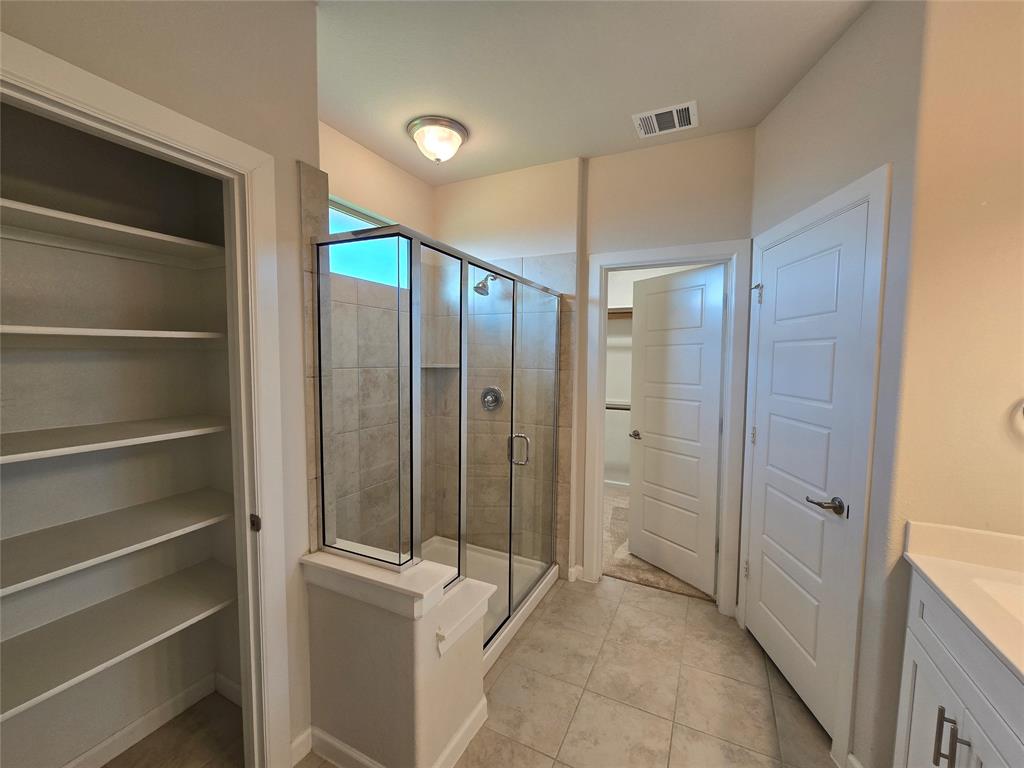 508 Williams Way Van Alstyne, TX 75495 - Photo 12 of 26 a bathroom with a shower and a sink