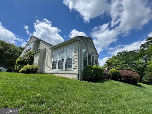 1720 Faversham Way Woodbridge, VA 22192 - Photo 11 of 30 a front view of a house with a garden