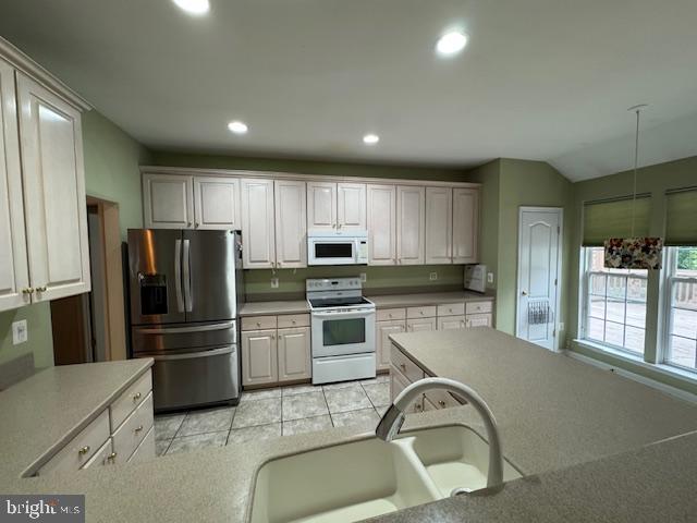 1720 Faversham Way Woodbridge, VA 22192 - Photo 6 of 30 a kitchen with granite countertop white cabinets and stainless steel appliances