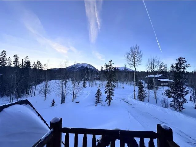 a view of a chairs and table in patio