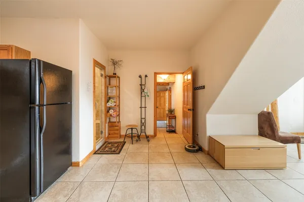 a view of a kitchen with refrigerator and washer