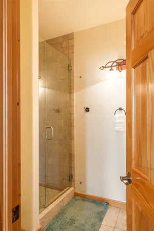 a bedroom with a bed and a closet