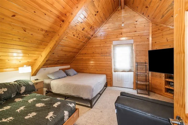 a bedroom with bed and a night stand