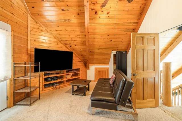 a view of living room with furniture and a flat screen tv