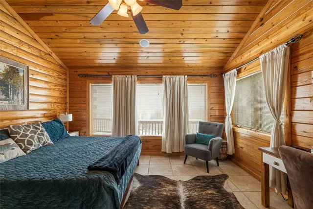 a bedroom with a large bed and a couch