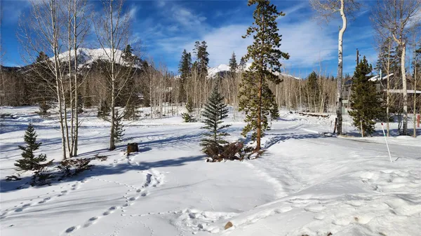 a kitchen with stainless steel appliances granite countertop a sink and a refrigerator