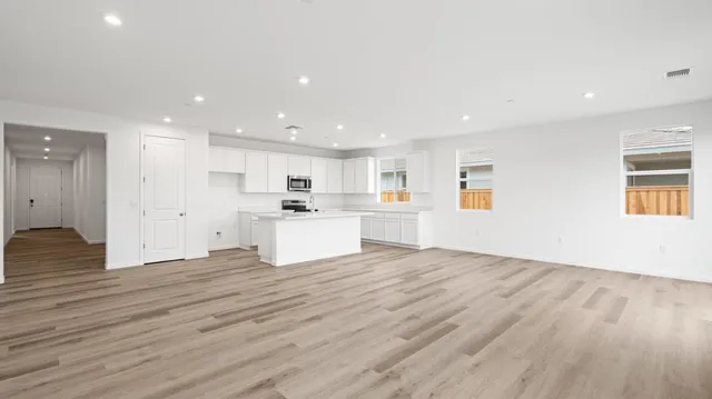 a view of kitchen with wooden floor