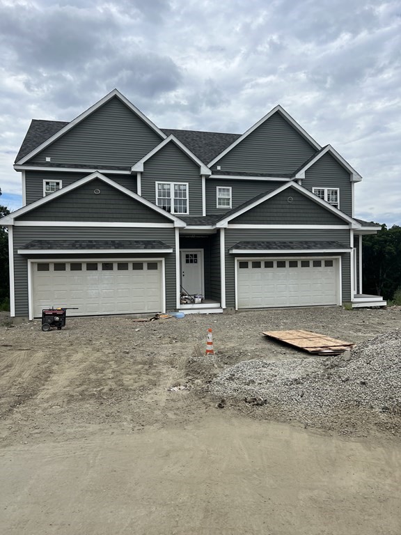 41 Modoc Street Worcester, MA 01604 - Photo 1 of 1 a front view of a house with a yard and garage
