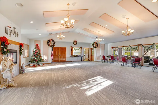 a view of a room with gym equipment and windows