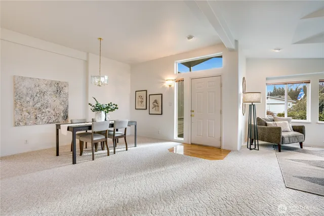 a view of a livingroom with furniture and a table