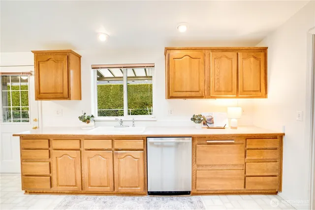 a kitchen with a sink and cabinets
