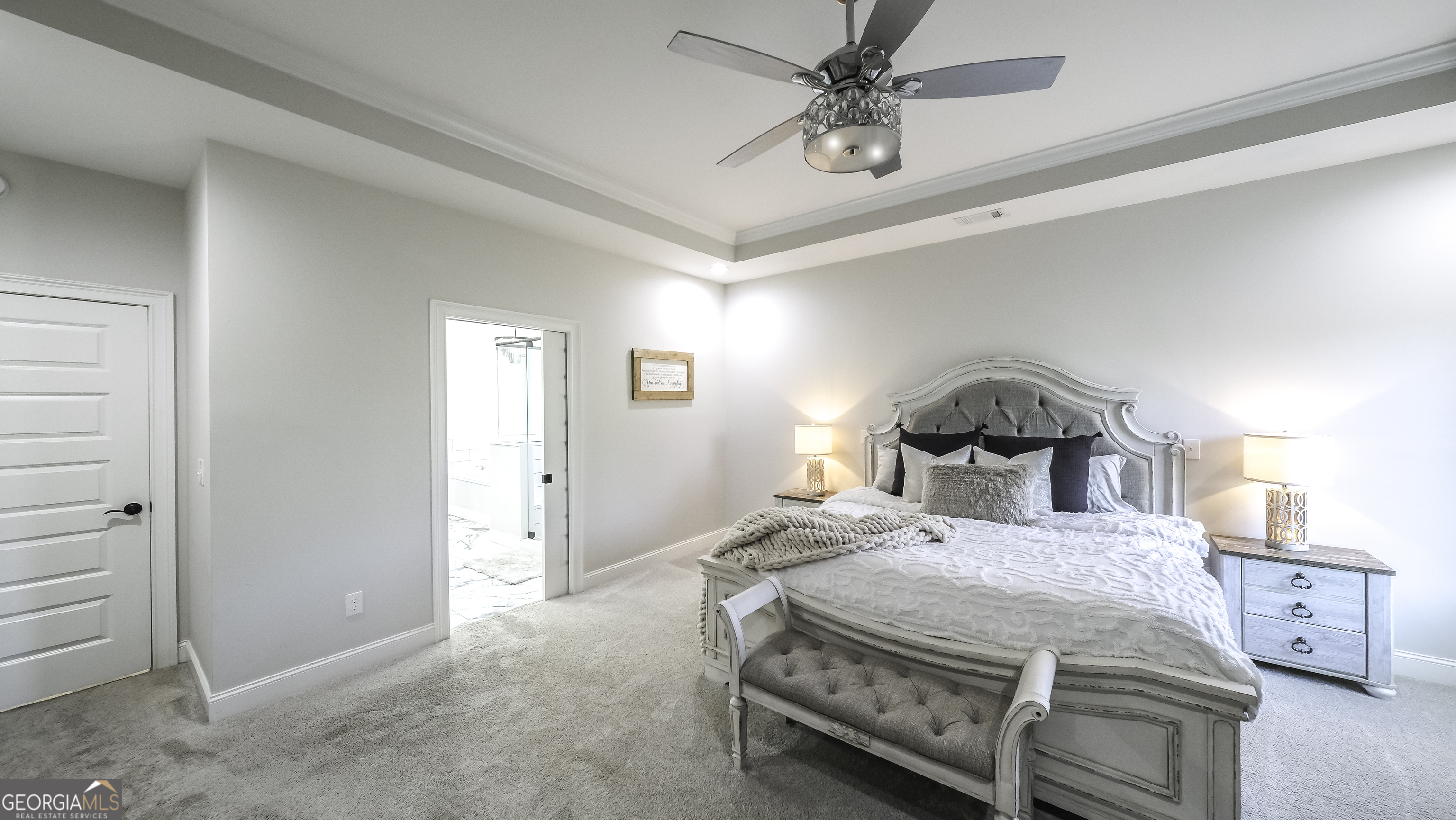 2392 Welcome Road Roopville, GA 30170 - Photo 24 of 43 a bedroom with a bed and a chandelier