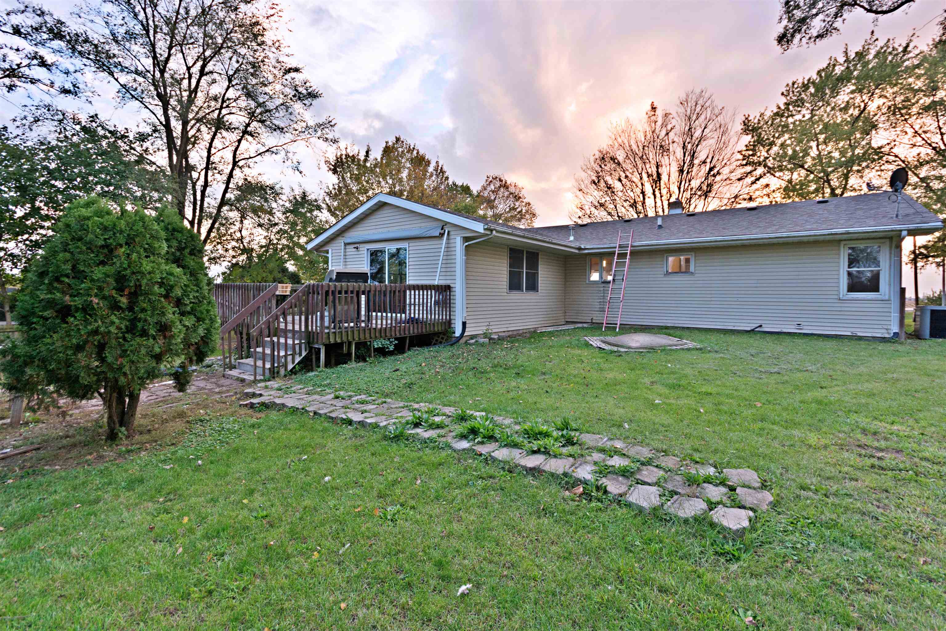 5677 North Meridian Road Rockford, IL 61101 - Photo 3 of 23 a backyard of a house with lots of green space