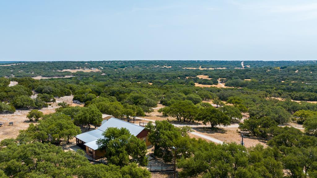 3417 Kc 443 Harper, TX 78631 - Photo 2 of 65 an aerial view of residential houses with outdoor space and trees
