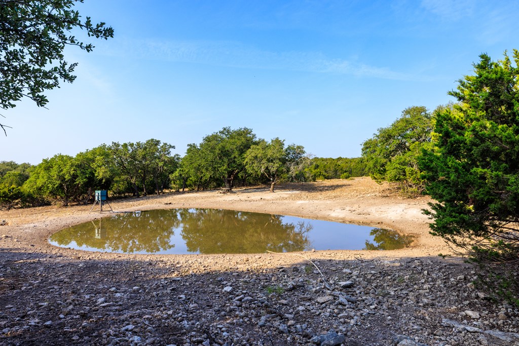 3417 Kc 443 Harper, TX 78631 - Photo 26 of 65 a view of a swimming pool with an outdoor space and seating area
