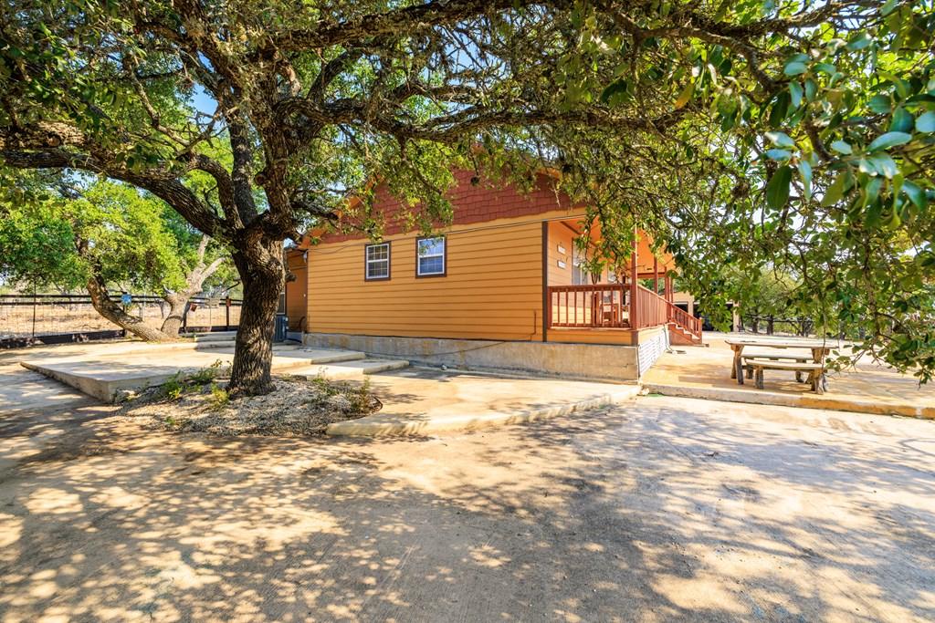 3417 Kc 443 Harper, TX 78631 - Photo 33 of 65 a backyard of a house with table and chairs